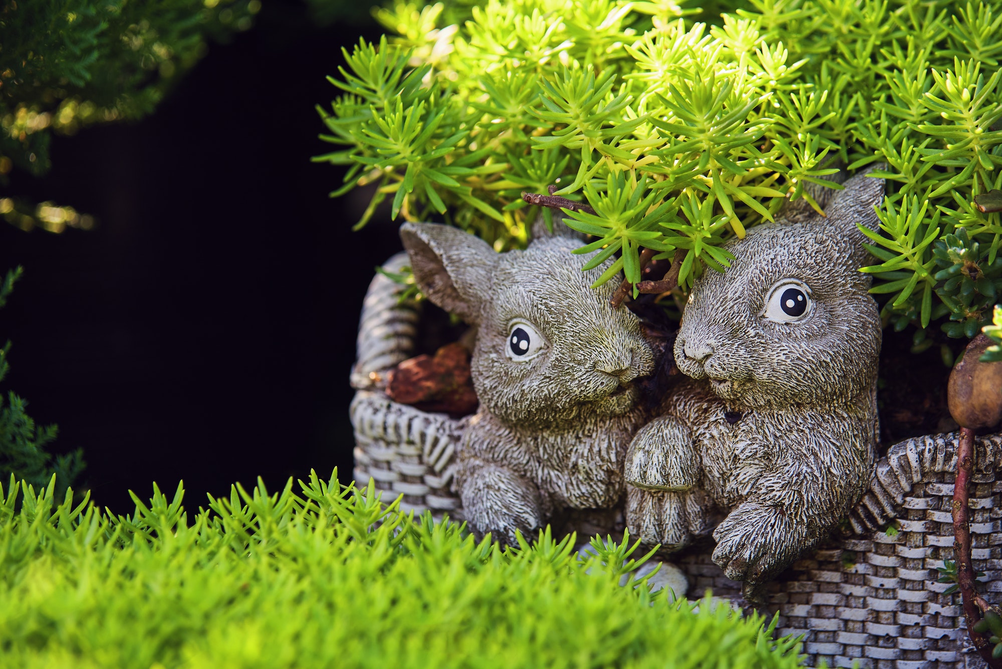 The statues lover rabbit with green leaves